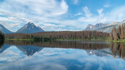 forest lake in front of the mountains