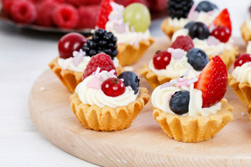 Colorful cupcakes with fresh fruits.