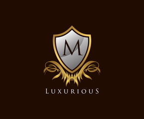 Classy Shield M Letter Logo. Gold Vintage Shield With M Letter prefect for boutique, hotel, restaurant, wedding and other elegant business. 