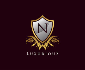 Classy Shield N Letter Logo. Gold Vintage Shield With N Letter prefect for boutique, hotel, restaurant, wedding and other elegant business. 