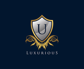 Classy Shield U Letter Logo. Gold Vintage Shield With U Letter prefect for boutique, hotel, restaurant, wedding and other elegant business. 