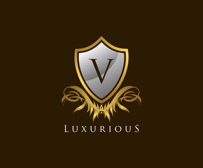 Obraz premium Classy Shield V Letter Logo. Gold Vintage Shield With V Letter prefect for boutique, hotel, restaurant, wedding and other elegant business. 