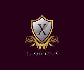 Obraz premium Classy Shield X Letter Logo. Gold Vintage Shield With X Letter prefect for boutique, hotel, restaurant, wedding and other elegant business. 