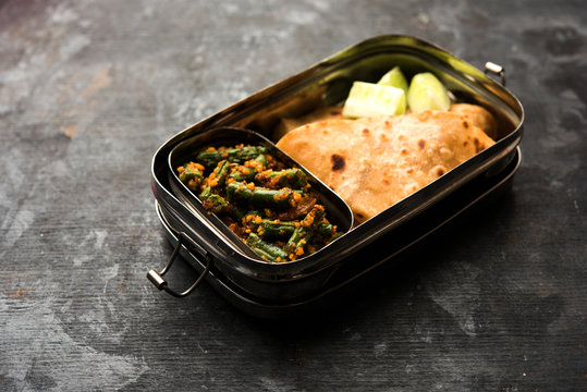 Lunch Box / Tiffin for Indian kids, includes beans vegetable sabzi with roti or chapati, selective focus