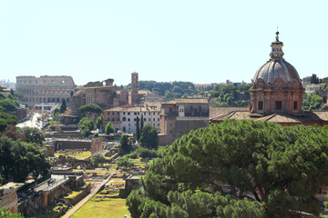 Fototapeta na wymiar Skyline view of Rome with Forum buildings and Colosseum