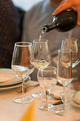 Glass of white, rose and red wine seen from close up.