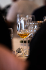 Glass of white, rose and red wine seen from close up.