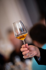 Glass of white, rose and red wine seen from close up.