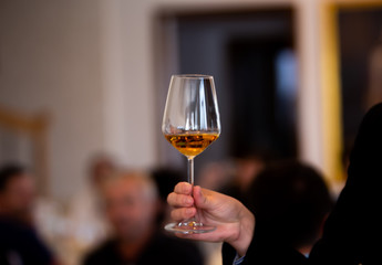 Glass of white, rose and red wine seen from close up.