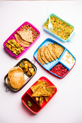 group of Lunch Box / Tiffin for Indian kids, showing variety or multiple option or combination of healthy food for your school going children