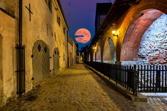 Fototapeta Nocturnal view on medieval street in old European town