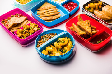 group of Lunch Box / Tiffin for Indian kids, showing variety or multiple option or combination of healthy food for your school going children