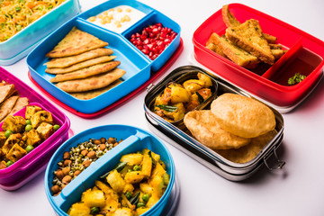 group of Lunch Box / Tiffin for Indian kids, showing variety or multiple option or combination of healthy food for your school going children