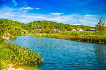 Fototapeta na wymiar Croatia, countryside rural landscape, village by Gacka river in region of Lika