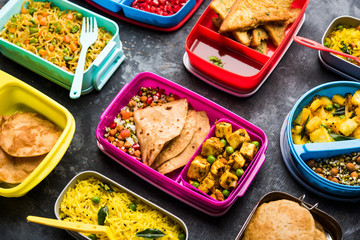 group of Lunch Box / Tiffin for Indian kids, showing variety or multiple option or combination of healthy food for your school going children
