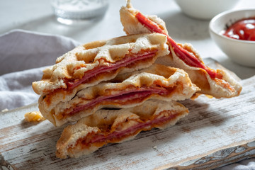 pizza waffle with ham, pepperoni and cheese