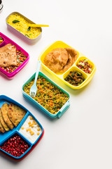 group of Lunch Box / Tiffin for Indian kids, showing variety or multiple option or combination of healthy food for your school going children