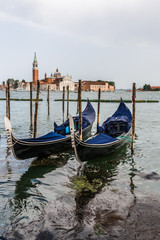 Fototapeta na wymiar Two gondolas off the coast of Venice