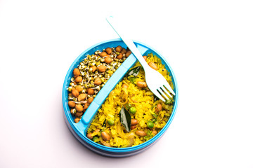 Lunch Box / Tiffin for Indian kids, hot Poha made using beaten rice and spices, accompanied with sprouts