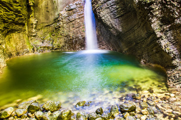 Fototapeta na wymiar Kozjak Waterfall. Emerald water. Caporetto, Slovenia.