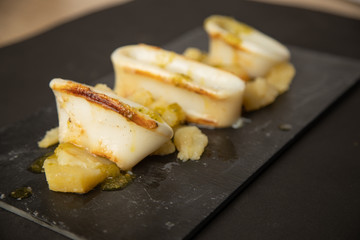 Spanish squid top with potatoes