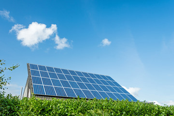 House with solar panels on the roof on a bright sunny day