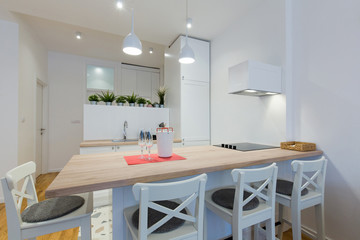 Interior of a open plan apartment, living room, kitchen, dining area
