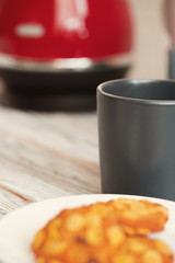 Cookies in a plate on kitchen counter close up