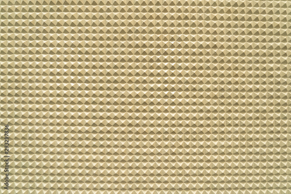 Poster triangle pyramid tiles pattern surface texture. close-up of architecture interior material for desig