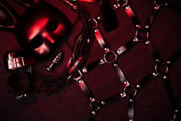 Leather Flogger, handcuffs, belt, choker, mask and metal anal plug for BDSM sex
