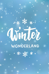Naklejka na ściany i meble Winter wonderland text, hand drawn brush lettering. Holiday greetings quote. Blue background with falling snow effect.