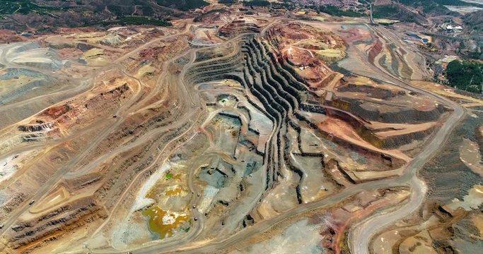 Open pit mine in the Rio Tinto in Spain. This is ore extraction in the production industry - aerial view with a drone - industry and landscape concept