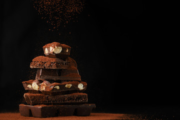 sprinkle a stack of chocolate bar cocoa powder