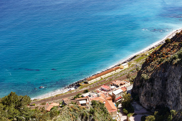 Obraz premium Aerial breathtaking view of Giardini Naxos railway station, shore of Ionian sea
