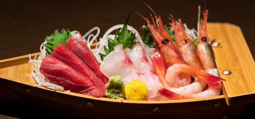 Assorted sashimi platter. Sashimi is fillet of raw fish. - obrazy, fototapety, plakaty