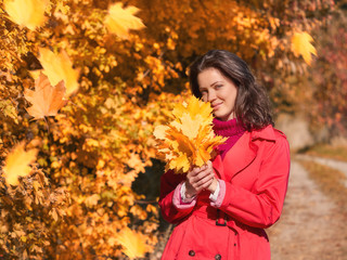 Young beautiful girl enjoying the autumn day