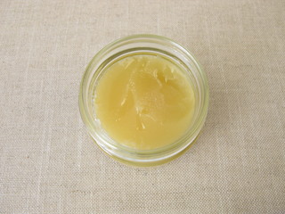A jar of with light yellow linden flowers honey 