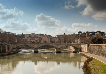 Fototapeta premium Rome, Italy, February 20, 2017 - view of Rome, Italy. Tiber River with bridges in Rome. Beautiful scenic panorama of Rome city.