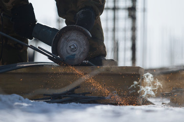 Cutting of construction materials with  angular grinding machine