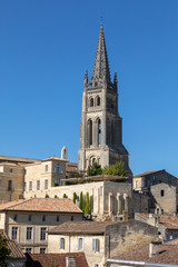 Fototapeta premium Bell tower of Monolithic Church in Saint Emilion. France. St Emilion is French village famous for the excellent red wine.