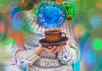Ball with zodiac symbols flying out of cup