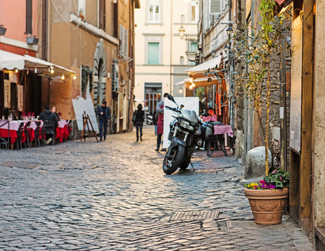 Old cobblestone narrow street in Rome, Italy