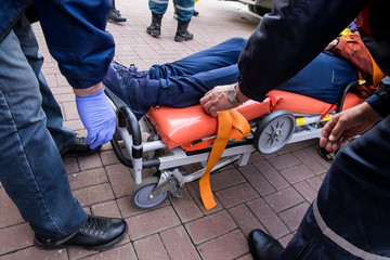 Emergency worker moving stretcher