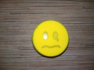 Deurstickers Yellow Groot smiley with a tear in his eye © ksenia