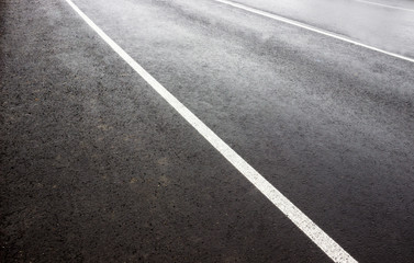 wet slippery road in bad weather
