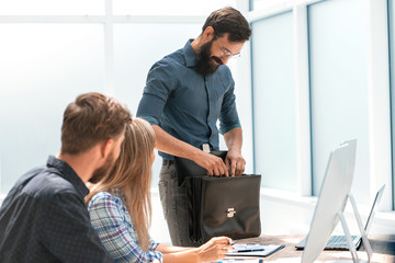business man with a leather briefcase in the office.