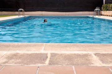 Fototapeta na wymiar woman swimming in a pool