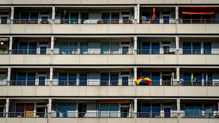 Facade of modern building with colorful umbrella