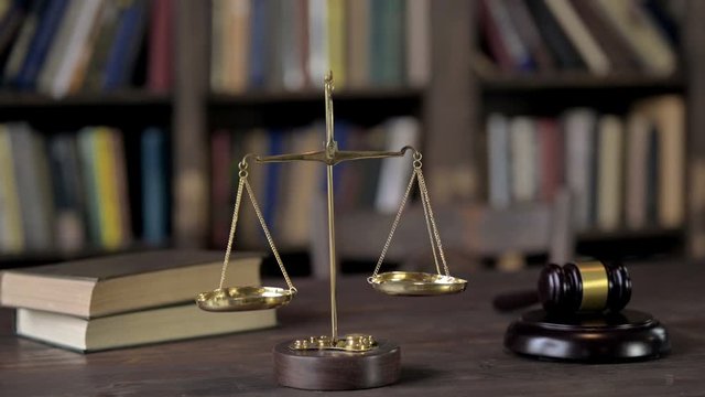 Gavel and Balance Scale on Judge Wooden Table