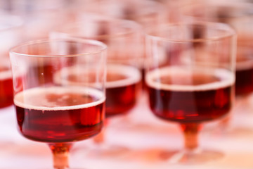 Sparkling wine in plastic glasses at reception